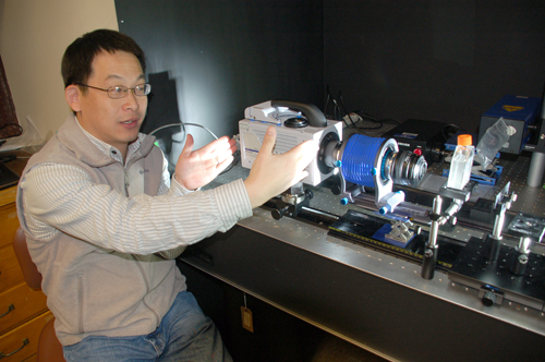 WHOI scientist Houshuo Jiang with the new high-speed, high-resolution video system he developed.: Photograph by Alison Satake, WHOI courtesy of NSF